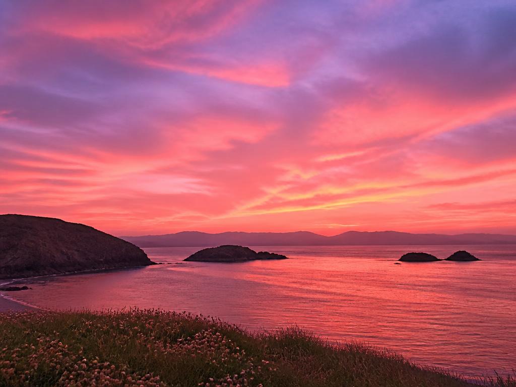 Sunset sky painted in blush and violet